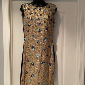 Gold sequin design. Black back size 10